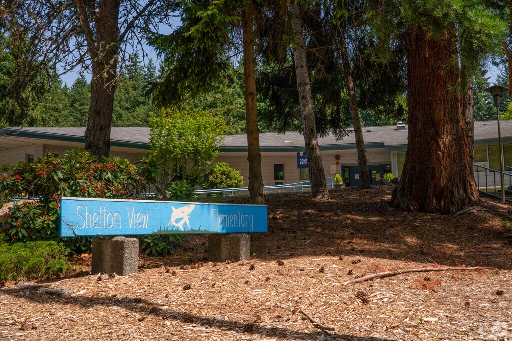 Shelton View Elementary in the Shelton View-Meridian-3rd neighborhood is surrounded by trees.