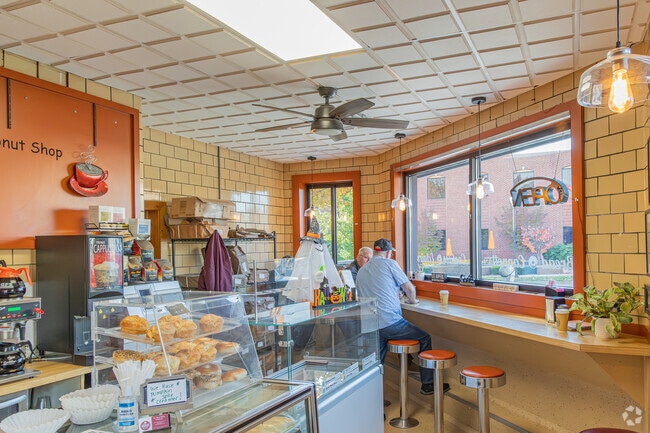 Almont residents enjoy donuts and coffee at The Almont Baking & Donut Co.