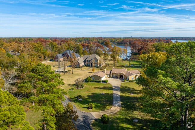 Sprawling estates in Lakeshore sit on several acres behind Cross Lake.