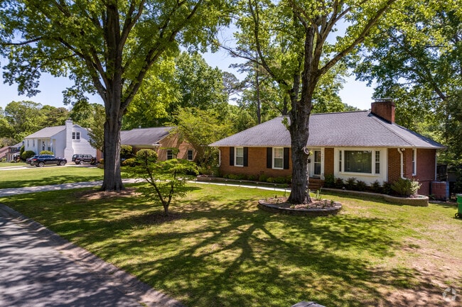 Brick ranch and split-level sit side by side in the Colonial Village neighborhood.