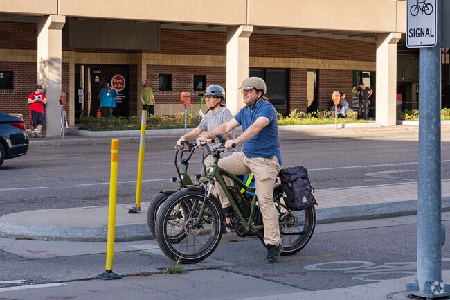 An Oak Hills couple enjoys a ride around downtown Lincoln on their electric bicycles.