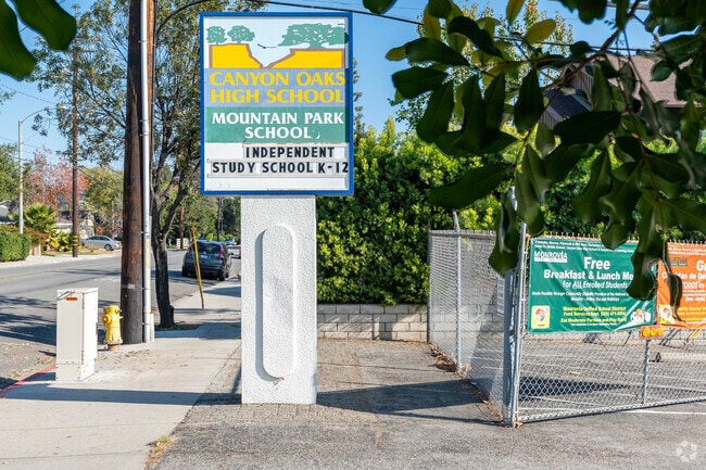 Mountain Park School parking lot view from the sidewalk.