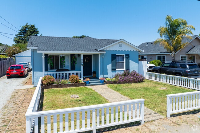 Bright-colored ranch-style homes sit along quiet residential streets.