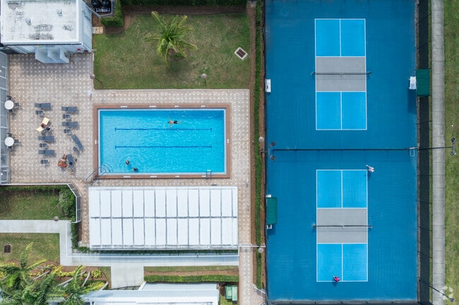 Savor Hillsboro Ranches' charm with outdoor pools and tennis courts.