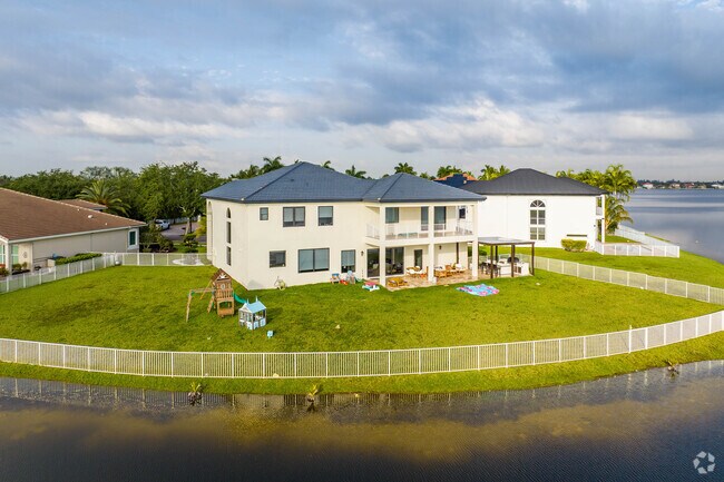 Traditional home along the water in Sunset Lakes.