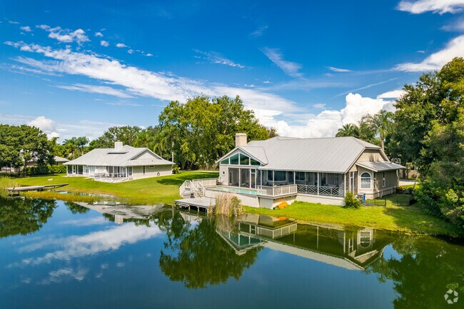 Enjoy tranquil surroundings in a waterside home in Bee Ridge, FL.