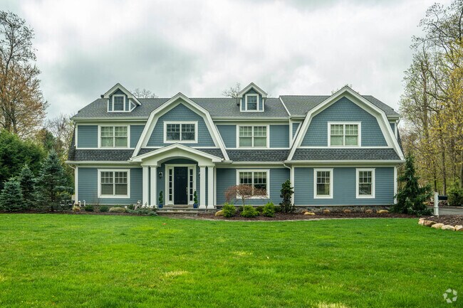 Residents can purchase large custom home in Allendale.