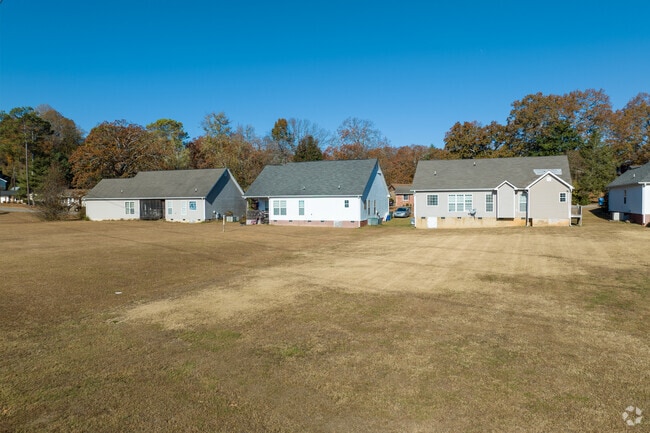 Newer construction homes can be close set on narrow but deeper lots like these by the park.