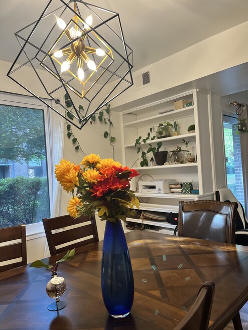 dinning room with built in bookshelf