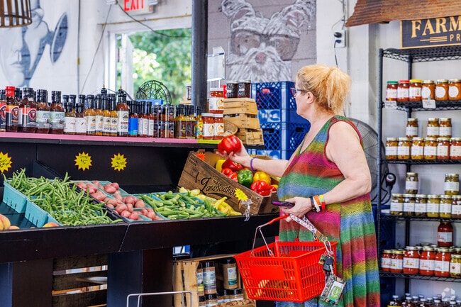 North Little Rock residents pick fresh locally grown veggies from the market at The Filling Station.