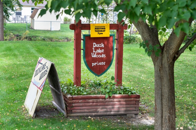 Duck Lake is a quiet neighborhood with many large deciduous trees amongst the properties.