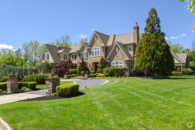 This beautiful stone front mansion is on a private cul-de-sac in Blue Bell.