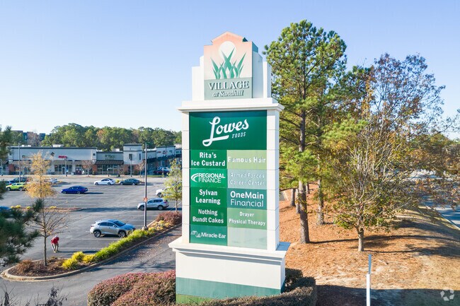 The plaque at the entrance of the Village at Sandhill in Pontiac-Elgin.