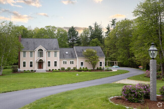 You'll find this impressive modern colonial home located in Stratham.