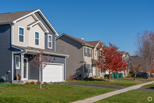 New Traditional homes line Malta’s quiet, sidewalk streets.