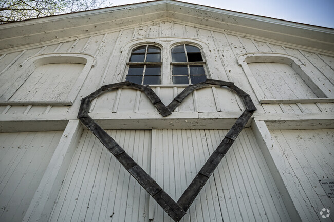 A heartwarming decoration adorns a vintage barn at Clinton Antique Mall.