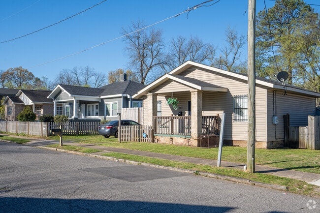 Summer days in Woodlawn are perfect for porch sitting and park visits.