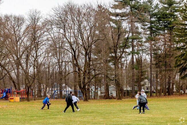 Folks play catch in large field at Mittineague Park in West Springfield.