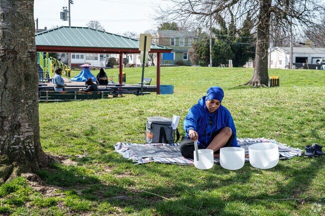A woman meditates with in Yeadon Community Park to the soothing sound of singing bowls.