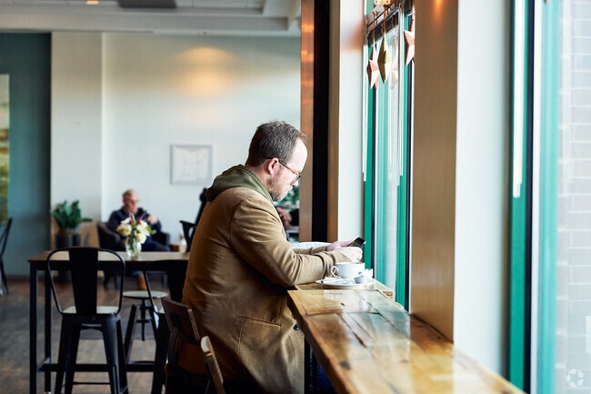 A resident stops for a warm cup of coffee on a cold winter day in Countryside.