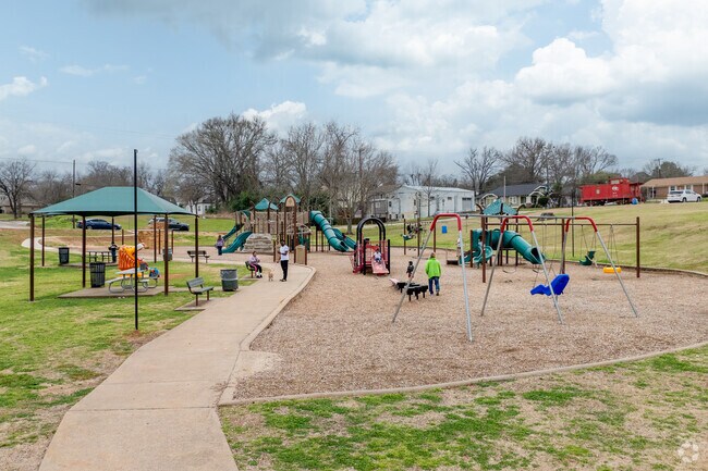 Let the kids run and play on the playground at Reagan Park.