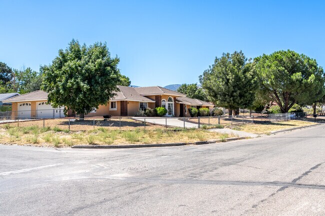 An array of large farmhouse-style homes dot the scenery in Phelan.