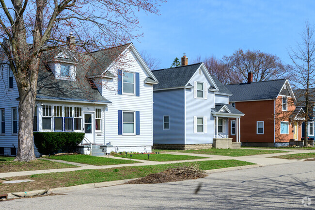 A row of homes in Washington Square share distinctive Tudor inspired roofline.