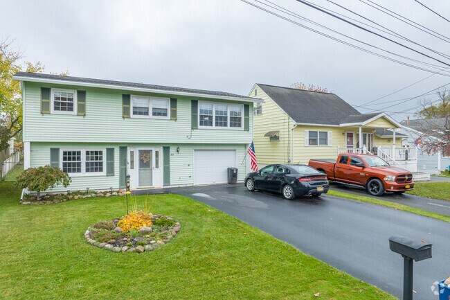 Colonial homes with vinyl siding are popular among the styles in the Lakeland neighborhood of Geddes.