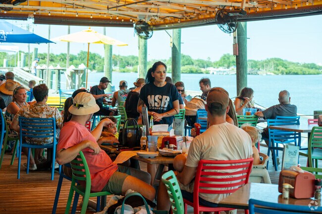 Bouchelle Island locals enjoy brews and seafood at River Deck just outside the neighborhood.