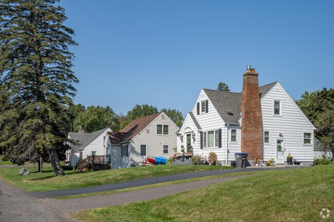 Brick chimneys and tall pines are common features of homes in Piedmont Heights.