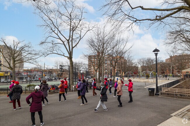 Residents of Elmhurst dance for exercise in Homestead Playground.