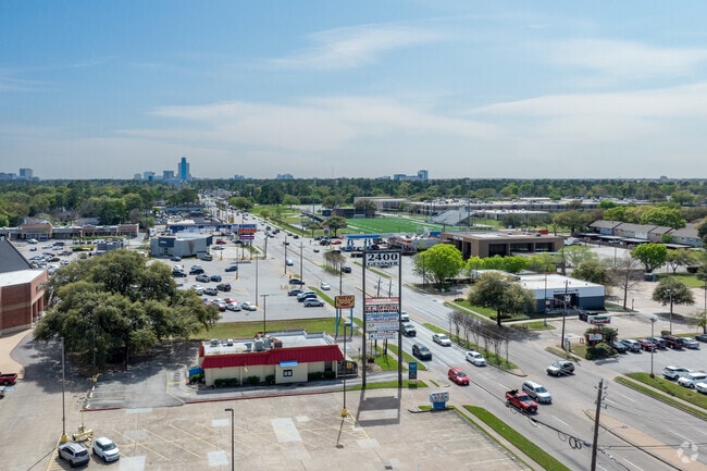 Witness the bustling activity of a Spring Branch West street from above.