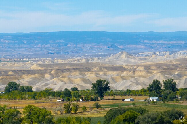 Orchard City provides a scenic backdrop to its farming community.