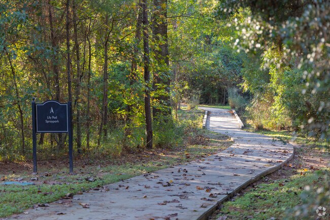 The trails in Wood Forest connect the community through vibrant natural sights.
