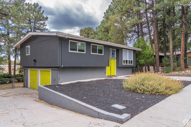 Driveways in Swiss Manor are sandwiched between stone-edged flowerbeds.