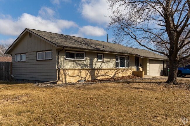 Some Northeast Ames homes have large lawns with mature trees.