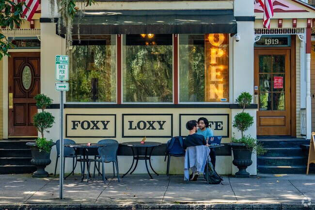 Residents sit outside the Foxy Loxy Cafe.