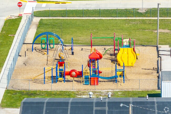 Younger children have a separate playground at Madrid Elementary School.