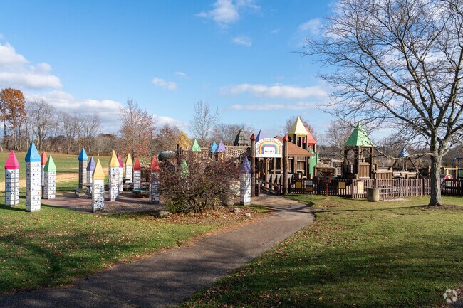 Kids enjoy the Magical Rainbow Playground at Mary C. Metzger Park in Louisville, Ohio.