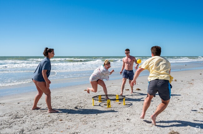 Friends frenzy around the slam ball game at Indian Rocks Beach nearby to Harbor Bluffs and Village Green.