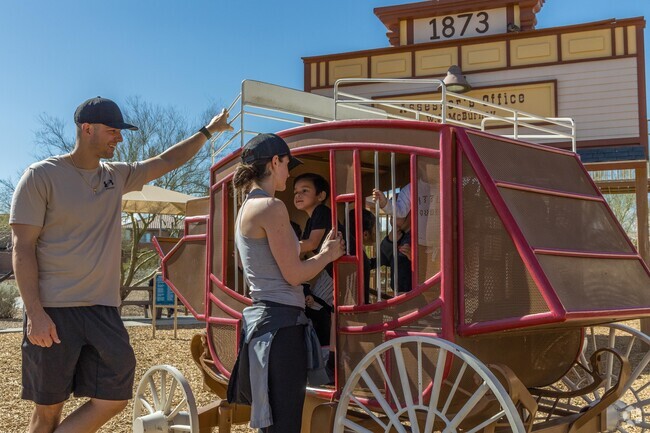 Visit Exploration Peak Park with the kids to explore an old western-style playground.