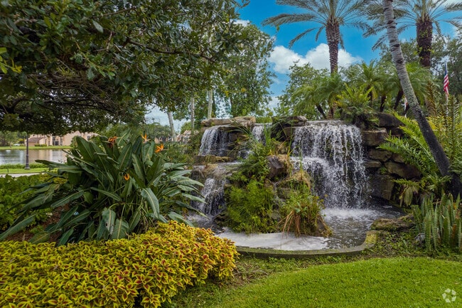 The Boca West complex entrance has its very own waterfall and plenty of plant life.