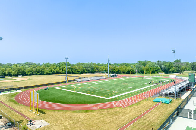 Football field with running track surround at Elk Grove High School property.