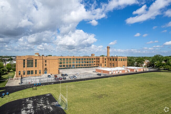 Football field and school overview at Foreman College and Career Academy