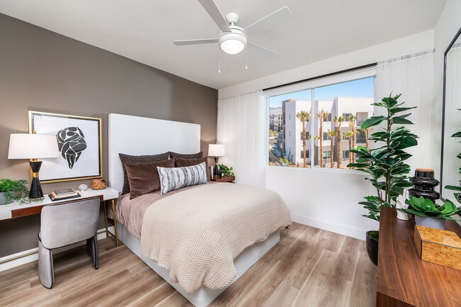 Secondary bedroom with light wood style flooring
