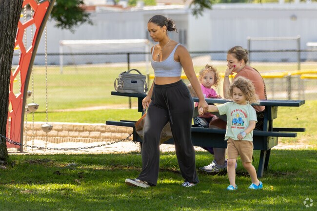 Young families love the shade and the cool coastal air at Jordan Park in Costa Mesa.