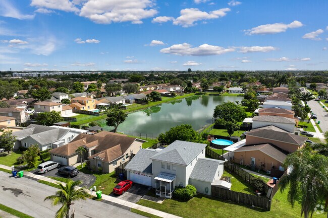 Most properties in Springtree Lakes were built in the 1980s and feature neutral pastel colored paint jobs.