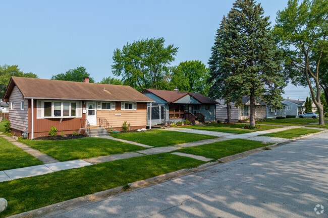A row of classic bungalow homes displaying the popular home style in Posen.