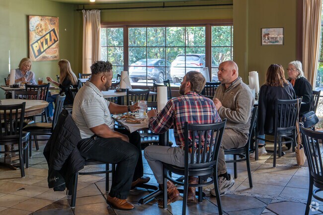 Dig into some pizza with friends at Midtown Pizza Kitchen near Great McGehee Estates.