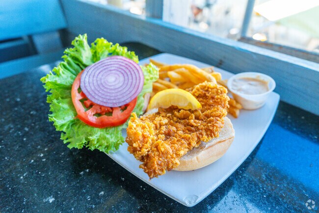 Waterstone residents enjoy a one of Black Pointe Grills most wanted fresh grouper sandwich.